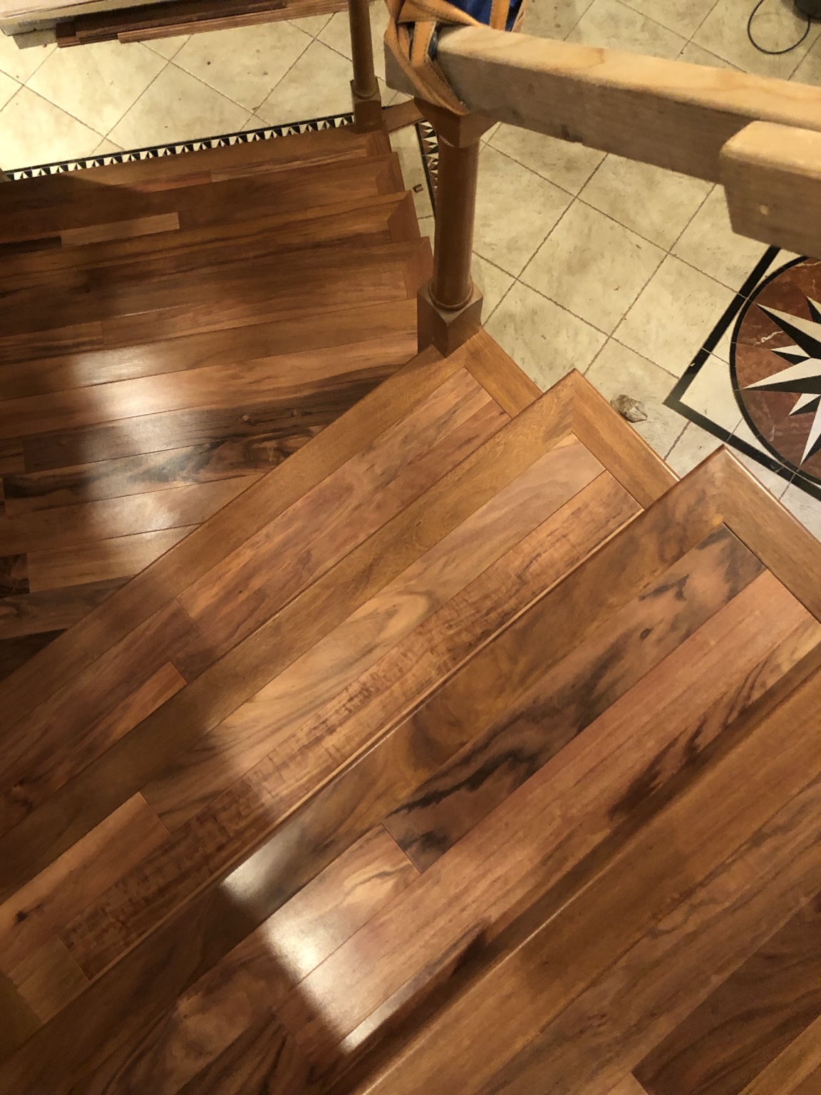 Detailed hardwood stair landing installation